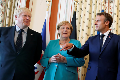 Премьер-министр Великобритании Борис Джонсон, канцлер Германии Ангела Меркель и президент Франции Эмманюэль Макрон